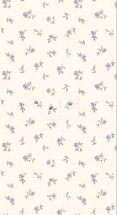 a white wall with purple flowers on it