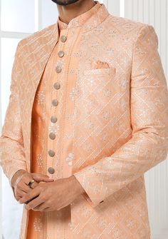 Readymade Art Silk Sherwani, and Jacket. Art Dupion Aligarhi Ready Made Trouser. Resham, Sequences, and Zari Work. Crafted in Chinese Collar Neck, and Full Sleeve. Faux Satin Lining with Plain Work. High-Quality Matching Buttons. Please Note: The footwear shown in the picture is for presentation and photography purpose only. Color: There might be slight color variation due to lightings and flashes while photo shooting. The color may also vary because of different screen resolutions. Wash Care: D Western Party Wear, Suit With Jacket, Indo Western Sherwani, Jacket Art, Western Party, Western Parties, Chinese Collar, Readymade Saree, Collar Neck