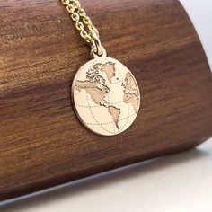 14K solid gold World Map Necklace, Earth jewelry, Gold Coin Globe gift, Earth charm, personalized gift, Traveler gift, Nautical Necklace Popular with all age groups. An ideal gift for anyone you love and it will be treasured forever. ⚜️ Pendant Material: 14K Solid Real Gold (NOT GOLD PLATED)  ⚜️ Hallmark for certification engraved on the back: 585 and my registered stamp  ⚜️ Design - We design everything in house.  ⚜️ Manufacturing - We make each piece we design in our workshop. The pendant is p Engraved Pendant Necklace Souvenir, Personalized Silver Necklace In Recycled Gold, Personalized Gold Necklaces In Recycled Gold, Engraved Round Pendant Jewelry As Souvenir, Personalized Gold Round Jewelry Gift, Gold Round Jewelry For Personalized Gift, Engraved Round Pendant Jewelry For Souvenir, Recycled Gold Round Charm Necklace As Gift, Yellow Gold Pendant Necklace As Souvenir