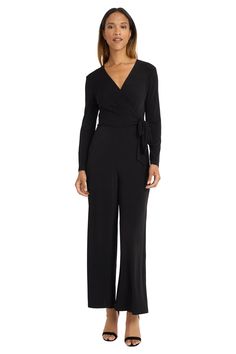 Meet Prudence, versatile wrap jumpsuit crafted from soft, stretchy jersey. This elegant one-piece features a flattering V-neckline, long sleeves, and wide-leg pants. Perfect for office wear, evening events, or travel. The self-tie waist ensures a custom fit for all body types. Easily dressed up with heels and statement jewelry or down with flats for casual outings. Dinner Jumpsuit, Elegant V-neck Jumpsuit With Buttons, Black V-neck Jumpsuit For Office, Evening Stretch Jumpsuit With V-neck, Office V-neck Black Jumpsuit, Elegant V-neck Jumpsuit With Button Closure, Wrap Jumpsuit, Bearded Lady, Social Dresses