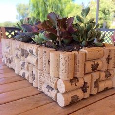 there is a planter made out of wine corks