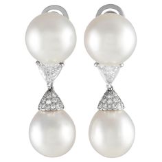 These Cartier earrings are ideal for even your most special occasions. The stunning 14mm Pearls are expertly accented by triangular Diamonds with a total weight of 2.05 carats and additional Diamond accents totaling 0.35 carats. Crafted from shimmering Platinum, each one measures 1.65 long by 0.50 wide.This jewelry piece is offered in estate condition and include the manufacturer's box. Diamond And Pearl Earrings, Cartier Earrings, Vintage Drop Earrings, Pearl And Diamond Earrings, Cartier Jewelry, Vintage Cartier, Cartier, Jewelry Pieces, Platinum