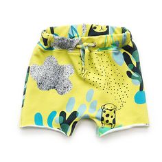 a yellow shorts with blue and green designs on it