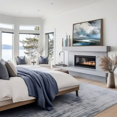 a bedroom with a bed, fireplace and large windows