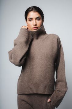 The Cio sweater in Chestnut has been knitted in Romania using a luxurious eco-cashmere yarn from a leading Italian mill. Featuring a relaxed fit, dropped shulders and elongated sleeves, wear your hair tucked in the turtleneck and pair with jeans or tailored pieces for an effortless look. Fit: Bianca, our model is 5.8" or 1.77 m tall and wears size 1. Made from a medium-weight knit, the sweater measures approximately 21" (53 cm) at front and 24"(60 cm) at back from shoulder to hem. Content: 100% Hair Tuck, Sustainable Wardrobe, Oversized Turtleneck, Cashmere Yarn, Womens Turtleneck, Chestnut, Medium Weight, Warm Water, Drop Shoulder