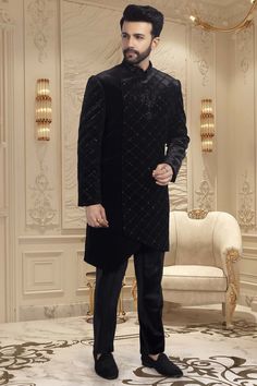 This black sherwani is adorned with delicate cutdana and shimmering sequins, making it an exquisite choice for sangeet ceremonies or reception nights. The perfect choice for any wedding, this sophisticated piece will have you looking and feeling your best. Formal Black Sequin Set, Black Sequined Formal Set, Black Sequin Sets For Formal Occasions, Black Party Wear Kurta For Diwali, Elegant Black Kurta With Intricate Embroidery, Traditional Black Bandhgala For Party, Festive Party Wear Sherwani With Resham Embroidery, Party Sherwani With Resham Embroidery, Fitted Black Bollywood Bandhgala