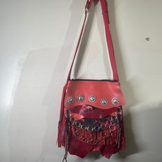 Here Is A Stunning Handmade Supple Leather Boho Southwest Hobo Long Fringe Crossbody Bag, This Opens To A Roomy Deep Compartment That Is Fully Lined With One Inside Zippered Pocket Made From Clean New Material. The Front Is Adorned With Silver Toned Metal Conchos. The Adjustable Strap And Fringe Are Made From Matching Leather. The Pictures Do Not Do Justice, You Will Be Astounded With Your New Show Stopping Bag! This Is A New Never Used Handmade Piece, Made Entirely In A Smoke Free Home In Maryl Red Shoulder Bag With Silver-tone Hardware For Evening, Red Evening Shoulder Bag With Silver-tone Hardware, Red Satchel Shoulder Bag With Palladium Hardware, Red Leather Festival Bag, Red Satchel Shoulder Bag For Festival, Red Shoulder Bag With Adjustable Strap For Festivals, Red Satchel Shoulder Bag With Silver-tone Hardware, Red Crossbody Shoulder Bag With Silver-tone Hardware, Red Festival Bag With Removable Pouch