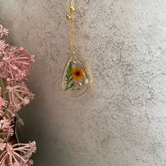 Orange Dried Pressed Flower Teardrop Resin Pendant Necklace With Greenery And Gold Crushed Glass Pretty Necklace Handcrafted With A Gold Toned Alloy Bezel And Set On An 18 Inch Gold Plated Brass Beaded Chain. The Pendant Is Just Over 1.5" In Long And .9" Wide. Each Item Is Handmade By Me And As A Result Will Be Individually Unique And May Vary Slightly From The Photos. Handmade Items May Contain Occasional Unique Imperfections Such As Bubbles Or Minor Flaws That Do Not Impact The Beauty Or Funct Belle Necklace, Swarovski Heart Necklace, Blue Crystal Necklace, Pink Pearl Necklace, Resin Pendant Necklace, Wooden Bead Necklaces, Pretty Necklace, Horse Necklace, Beaded Cross