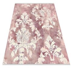 a pink and white area rug with an ornate design on the top, in front of a white background