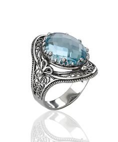 This gorgeous handmade filigree art statement ring will draw all the right kind of attention. Made of sterling silver, it is oxidized and highly polished. The ring face is 0.97" / 24.70 mm X 0.65" / 16.50 mm. Its elegant minimal design is a perfect accessory to any outfit, making this anniversary gift or birthday gift the best option for everyday wear. Sizes from 5 to 12.5 with half sizes. A stunning ring for any occasion. Comes with a gift box, velvet pouch, silver polish cloth and care card to Birthday Gemstones, Art Statement, The Ring Face, Silver Polish, Blue Topaz Gemstone, Blue Stone Ring, Statement Ring Silver, Sterling Silver Filigree, Outfit Making