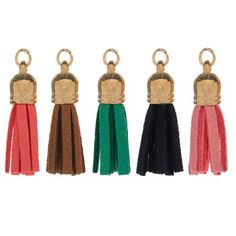 four key chains with tassels in different colors