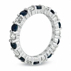 a white gold ring with blue and clear stones