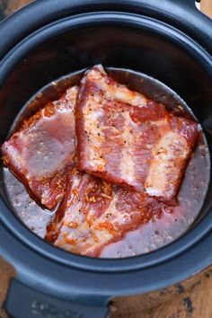 three pieces of meat in a slow cooker