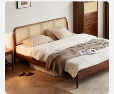 a bed sitting on top of a wooden floor