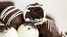 chocolate cake truffles stacked on top of each other with white and brown frosting