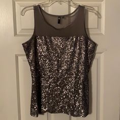 Never Worn Metallic Shimmer Sleeveless Tank Top, Metallic Sleeveless Tops For Party Season, Metallic Sleeveless Spring Top, Metallic Sleeveless Top For Spring, Metallic Sleeveless Tank Top For Party Season, Shimmer Sleeveless Tank Top For Spring, Sleeveless Shimmer Tank Top For Spring, Elegant Shimmer Sleeveless Top, Elegant Sleeveless Shimmer Top