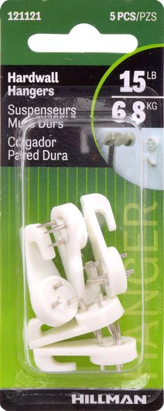 a package of white plastic clips for furniture