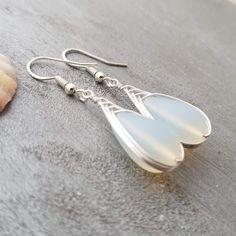 "Aloha! These design shows my love for this beautiful island of Hawaii. This item will be made to order and shipped directly from Hawaii. This is a sea glass earring with a tarnish resistance silver plated chainhook. This handmade in Hawaii jewelry gift is from cultured sea glass that are specially formed into its shape for jewelry making. Each comes with a gift box with \"handmade by yinahawaii\" stamp and a ribbon wrapped as shown in the 2nd photo, ready to give as gift. I also offer Free gift Gift Dangle Earrings Made Of Sea Glass, Elegant Jewelry With Sea Glass And Ear Wire, Elegant Sea Glass Jewelry With Ear Wire, Bohemian Sea Glass Jewelry For Jewelry Making, Silver Teardrop Sea Glass Jewelry, Sea Glass Teardrop Earrings As Gift, Teardrop Sea Glass Earrings For Gift, Handmade Sea Glass Drop Earrings, Handmade Teardrop Chalcedony Jewelry