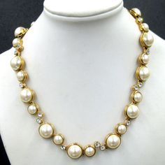 This Stunning Vintage Old Store Stock 1980's Necklace Features Large 12mm And 8mm Glowing Faux Mabe' Pearls Accented With Glittering Rhinestones. The Linked Design Allows This Fabulous Necklace To Lay Fluidly Around The Neck. The Gold Tone Plating Is In Mint Condition. The Fold Over Slap Closes Securely. Still Retains The Original Store Tag With $128 Price Tag. 16 1/4". Rhinestone Collar, The Fold, Price Tag, Collar Necklace, Fold Over, Womens Jewelry Necklace, Mint Condition, Faux Pearl, Size 16