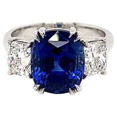 7.87 Total Carat Sapphire and Diamond Ladies Ring. GIA Certified. -Metal Type: Platinum -6.27 Carat Cushion Cut Natural Blue Sapphire, GIA Certified -Sapphire Measurements: 10.62 x 8.77 x 7.45 mm -0.80 Carat Cushion Cut Natural side Diamond. GIA Certified (Report: 2155461561). H Color, VS1 Clarity -0.80 Carat Cushion Cut Natural side Diamond. GIA Certified (Report: 2155461646). H Color, VS2 Clarity -Size 6.5 Made in New York City. Luxury Blue Sapphire Ring As Gift, Luxury Gia Certified Sapphire Jewelry, Luxury Fine Jewelry Sapphire Ring As Gift, Ring Cushion, Cushion Ring, Ladies Ring, Sapphire Diamond Ring, Natural Blue Sapphire, Jewelry Business