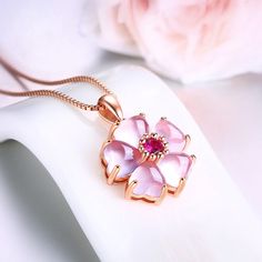 Chic Pink Opal Heart Cherry Blossom Pendant Necklace This adorable Chic Pink Opal Heart Cherry Blossom Pendant Necklace adds a touch of cuteness to any outfit. The delicate pink opal heart and cherry blossom design make it the perfect accessory for any occasion. Stand out from the crowd with this charming necklace. Boyfriend Girlfriend Necklaces, Rose Violette, Moonstone Crystal, Flower Pendant Necklace, Necklace Fashion, Silver 925 Necklace, Copper Necklace, Silver Plated Necklace, Crystal Necklace Pendant