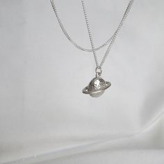 The pendant is crafted from high-quality sterling silver,  a delicate silver chain, offering a minimalist yet elegant look. Overall, it's a stylish accessory that combines celestial themes with a touch of sophistication. *  925 solid sterling silver - all components, *  Saturn planet size: 12 mm height, 16 mm width, *  high quality, *  chains: 16", 18" or 20". https://meloujewellery.etsy.com Free shipping will be provided to the UK customers. Please note, no tracking number will be available wit Sterling Silver Layered Necklace, Silver Layered Necklace, Space Necklace, Saturn Necklace, Saturn Planet, Christmas Gifts For Mum, Best Friend Necklace, Planet Necklace, Best Friend Necklaces