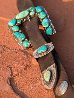 One of my favorite things to design, sterling silver and American turquoise "Ranger" buckles are inspired, artful creations. They look amazing with our vintage latigo belts or Wild West turquoise concho belts. This set is unique that it has a top, keeper, and A beautiful combination including natural Piolet Mountain and Royston turquoise. Our On the Range finish 3.5 to 4 inch size range. Please contact me for availability and pricing. I do my best to keep these in production, but often times hav Vintage Turquoise Belt With Concho, Vintage Adjustable Turquoise Belt, Adjustable Vintage Turquoise Belt, Adjustable Turquoise Vintage Belt, Western Turquoise Belt With Concho, Turquoise Western Belt With Concho, Southwestern Turquoise Jewelry With Antique Buckle, Turquoise Bohemian Belt Buckle With Antique Detail, Navajo Silver Jewelry