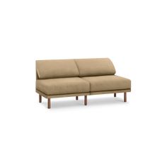 a beige couch with wooden legs on a white background