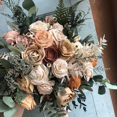 a bouquet of flowers sitting on top of a table