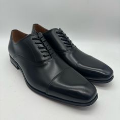 Elevate Your Style With These Sleek Florsheim Carino Cap Toe Oxford Black Dress Shoes In Men Size 11 D. The Shoes Feature A Solid Pattern And A Black Color That Exudes Sophistication, Making Them Perfect For Formal Occasions. Made With High-Quality Leather Materials, Both The Lining And Upper Materials Are Durable And Comfortable To Wear. The Shoes Also Boast A Synthetic Outsole That Provides Excellent Traction And Stability, And A Cap Toe Design That Adds A Touch Of Elegance. These Dress Shoes Black Almond Toe Oxfords For Business, Fitted Leather Business Shoes With Closed Toe, Business Leather Shoes With Closed Toe, Plain Toe Black Business Dress Shoes, Black Plain Toe Business Dress Shoes, Black Plain Toe Dress Shoes For Business, Fitted Closed Toe Oxford Dress Shoes, Fitted Oxford Dress Shoes With Closed Toe, Business Oxford Dress Shoes With Closed Toe