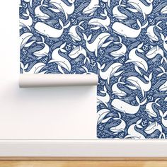 a blue and white wallpaper with an abstract design