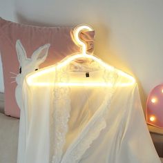 a white shirt with a light up hanger on it