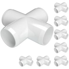 an assortment of white plastic pipes and fittings