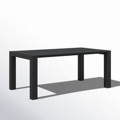 a black table sitting on top of a white floor