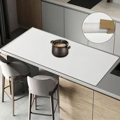 a kitchen table with two chairs and a pot on the counter top in front of it