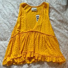 Super Cute Yellow Top, Perfect Condition! Affordable Yellow Tops From Urban Outfitters, Urban Outfitters Summer V-neck Tank Top, Urban Outfitters V-neck Tank Top For Spring, Urban Outfitters Sleeveless Tank Top For Spring, Urban Outfitters Sleeveless Spring Tank Top, Urban Outfitters V-neck Tank Top For Beach, Urban Outfitters Tank Top For Spring Day Out, Urban Outfitters Summer Tank Top, Summer Tank Top From Urban Outfitters