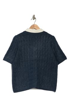 This cable-stitched sweater is contrasted by a woven collar in this twofer top that elevates in-office or off-duty looks. 19 1/2" length Point collar Short sleeves 73% acrylic, 24% polyester, 3% spandex Machine wash, tumble dry Imported Fall Workwear Cable Knit Tops, Fall Cable Knit Tops For Workwear, Cable Knit Crew Neck Tops For Work, Blue Collared Polo Sweater For Workwear, Blue Polo Sweater With Ribbed Collar For Work, Collared Textured Knit Sweater For Work, Short Sleeve Sweater With Ribbed Collar For Work, Blue Sweater With Ribbed Collar For Work, Navy Top With Contrast Collar For Workwear