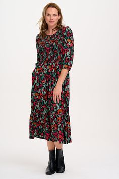 Our Trudie Smock style works year round. This style has an elasticated shirred bust, full length sleeves with frill cuffs and a full midi skirt. The playful hand-drawn 'Lost Dinosaur' print features scenes of dinosaurs among foliage. This print has an Autumnal feel with dark green, sage, tan, mustard and deep magenta pink. LENZING™ ECOVERO™ Viscose fabric is sustainable, lightweight and breathable, meaning you can wear it all day in comfort. 100% LENZING™ ECOVERO™ Viscose, Machine wash (delicate) Deep Magenta, Full Midi Skirt, Green Sage, Brand Magazine, Shirred Dress, Magenta Pink, How To Make Clothes, Blazer With Jeans, Viscose Fabric