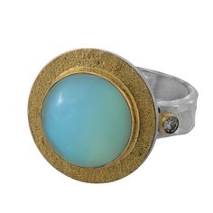 This lovely one-of-a-kind ring has been handmade in our workshops. It features a central blue chalcedony, set in 18ct gold which is flanked with full cut diamonds also set in 18ct gold. The shank is made of hammered sterling silver. 18ct gold embedded with a chalcedony and diamonds with a silver shank.  Store your jewellery in a soft lined pouch or box separately so they don't damage each other.  Precious metals naturally tarnish with exposure to air as well as perfumes, moisturiser, makeup, hairspray, perspiration, household cleaning products, chlorine and salt. Please avoid exposing your jewellery to these conditions and always remove it before swimming, showering, exercising or sleeping to extend your jewellery's life and shine. April Birthstone Jewelry, March Birthstone Jewelry, Forever Jewelry, Hammered Sterling Silver, Bon Bon, Pearl Jewellery Earrings, Blue Chalcedony, Evil Eye Jewelry, Fine Jewelry Gift