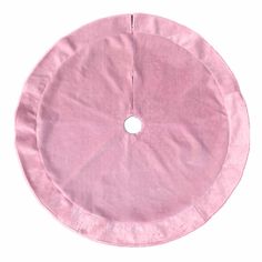 a round pink cloth with a hole in the center