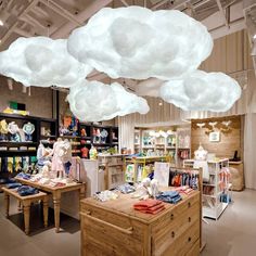 there are clouds hanging from the ceiling in this store