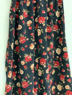 Vintage black floral skirt Approximate Size: 13 W; 33 L Black Floral Print Skirt, Black Floral Print Maxi Skirt For Spring, Black Floral Print Skirt For Summer, Black Floral Print Flowy Skirt, Black Flowy Floral Skirt, Summer Black Maxi Skirt With Floral Print, Chic Black Floral Print Maxi Skirt, Black Skirted Bottoms With Floral Print, Black Floral Print Mini Skirt