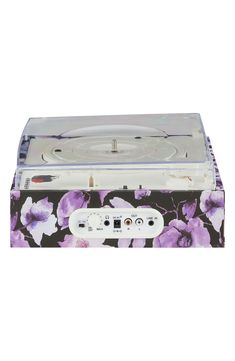 a record player with purple flowers on it