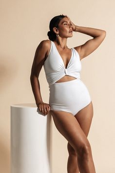 Discover Coco, an ultra-high-waist bikini bottom that seamlessly blends timeless style with casual luxury. This simple yet striking contrast creates a contouring effect that flatters shapes of every kind. Embodying a mantra of ”less is more”, the Coco is set to become your new swimwear staple.  Wear as a set with the Coco Reversible Bikini Wrap Top, or pair with the Black Dahlia Multiway Skirt, Black Long Sleeve Swim Wrap Top, or the Black or White Mesh Sarong for the complete look. New Swimwear, Swim Wrap, The Black Dahlia, Italian Fabrics, White Bathing Suit, Long Sleeve Swim, Black Dahlia, Casual Luxury, Swimwear High Waisted