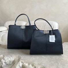 Hi, I have this gorgeous bags with silver hardware, two sizes. Its genuine leather, made in Italy.  Measurements small  Height 25 cm  Width 33 cm  Leather Strap: Length 80cm  Measurements big  Height 30 cm  Width 33 cm  Leather Strap: Length 80cm  If you have any questions please text me. Thank you Everyday Handbag, Student Bag, Handbag Black, Gorgeous Bags, Tote Purse, Black Bag, Handle Bag, Bag Women, Bag Shoulder