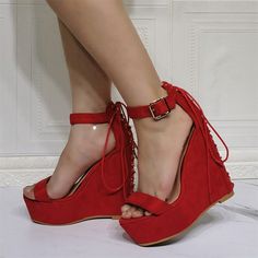 Elevate your style with these stunning Red Open Toe Platform Wedges. Featuring a classic ankle strap design and high heels, these sandals are perfect for adding flair to any outfit. Color: Red Heel Type: Wedge heel Heel Height: 5.9" / 150 mm approx Product measurements were taken using size 8. Please note that measurements may vary by size. Toe: Open toe With platform Back lace-up design Handcrafted US sizing. Fits true to size. Tea Outfit, Cowboy Shoes, Red Platform, Sandals Platform, Spot Lights, Ankle Strap High Heels, Platform Wedge Heels, Red Heels, Lace Up Sandals