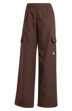 Get an effortless sporty look with these relaxed-fit cargo pants crafted from recycled fibers and branded with a petite embroidered Trefoil. 31" inseam; 22" leg opening; 11" front rise; 14" back rise (size Medium) Elastic waist Side-seam pockets; cargo flap-patch pockets 100% recycled polyester Machine wash, tumble dry Imported Sporty Pants, Sporty Look, Cargo Pants, Adidas Originals, Elastic Waist, Recycling, Nordstrom, Relaxed Fit, Size Medium