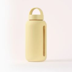 a yellow water bottle with a wooden handle on a white background in front of the camera