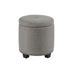 a round ottoman with black legs and grey upholstered fabric on the top, in front of a white background