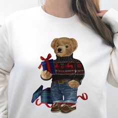 As cosy as it is adorable, this Teddy Bear sweatshirt will keep you warm and looking stylish this Festive Season. Printed with trendy teddy bear illustration on your chosen jumper colour. Our customers love the way it feels against your skin, with soft fleece lined fabrick and just the right amount of stretch for a relaxed yet flattering fit. Our sweatshirts are made from premium eco friendly, thick fabric. Here's why you'll love it: Made from 85% organic cotton and 15% recycled polyester Heavy Teddy Bear Illustration, Teddy Bear Sweatshirt, Teddy Bear Christmas, Bear Sweatshirt, Bear Sweater, Winter Bear, Bear Illustration, Bear Christmas, Club Sweatshirts